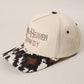 MAKE HEAVEN ROWDY Embroidered Cow Print Brim Trucker Hat