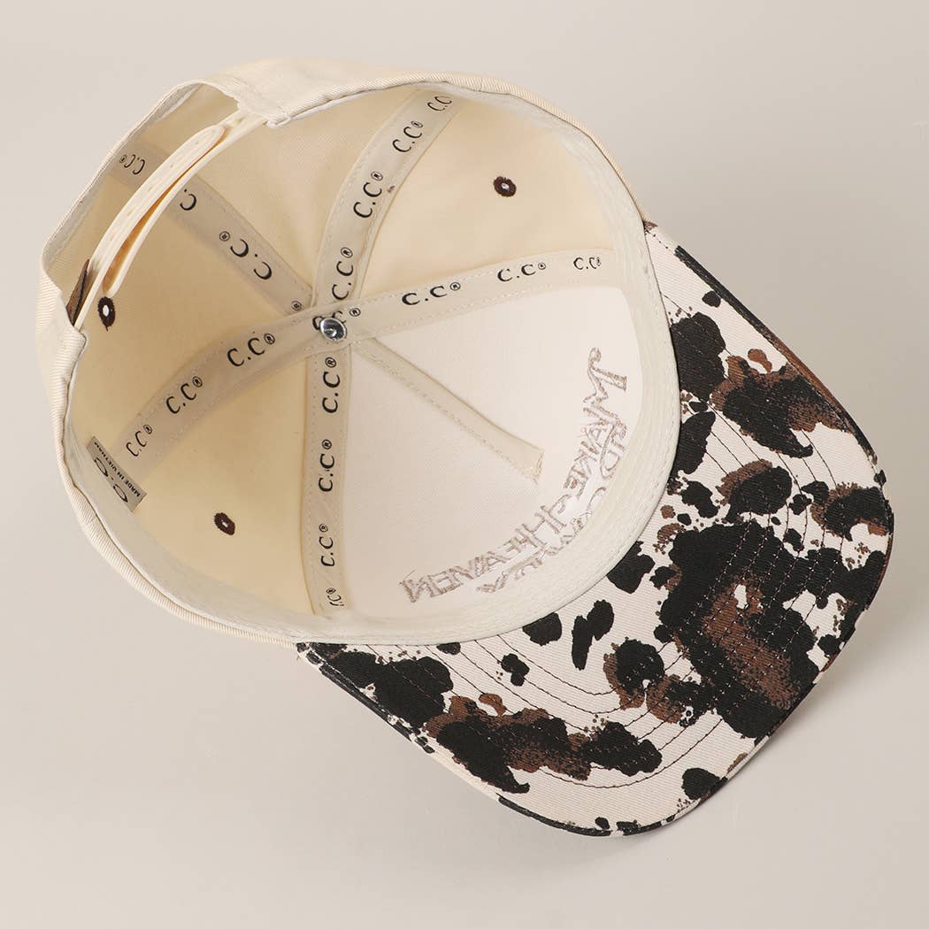 MAKE HEAVEN ROWDY Embroidered Cow Print Brim Trucker Hat